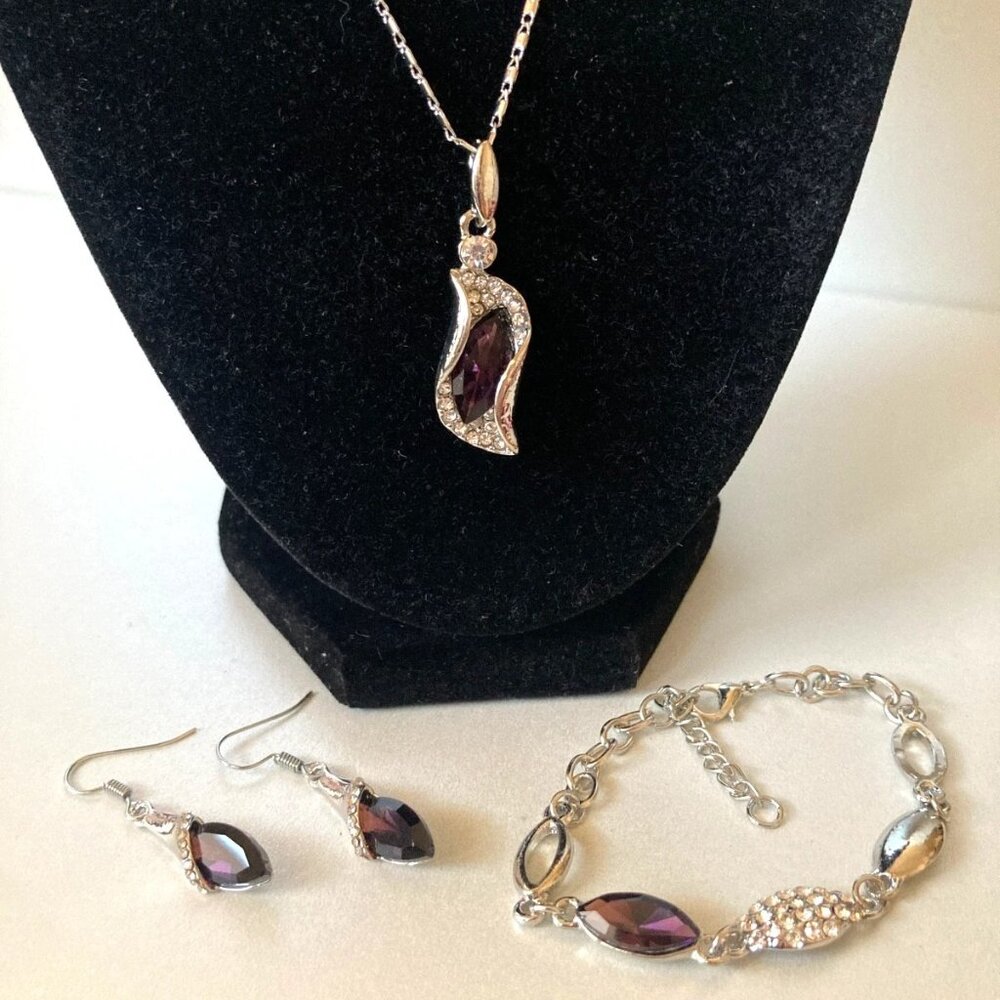 NWOT dark violet crystal earrings, necklace, and bracelet jewelry set